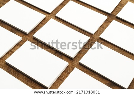 Blank businesscard stacks on rough wooden table