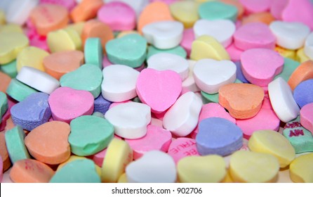 A Blank Candy Heart Surrounded By Other Candy Hearts For Your Message.