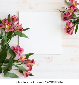 blank canvas with Alstroemeria flowers on white wood background