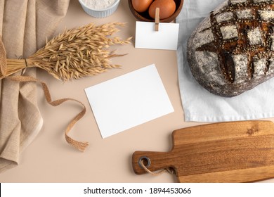 A Blank Card, With Bread, Eggs, Flour, Serving Board, Bakery Branding Mockup, Empty Space To Display Your Logo Or Design.