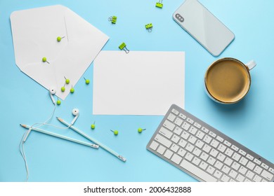 Blank Card With Envelope, Stationery, Cup Of Coffee And Computer On Color Background