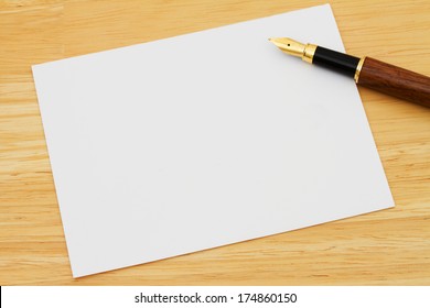 A Blank Card With A Fountain Pen On A Wooden Desk, Writing A Personal Note