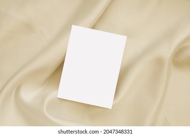 Blank Card On Neutral Color Silk Fabric, Mockup For Care Instruction Card, Wedding Invitation Design.  