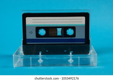 Blank Cassette Tape Box On Blue Background. Vintage Cassette Tape Case With Retro Cassette Mockup. Plastic Analog Magnetic Clear Packaging Template. Mixtape Box Open 