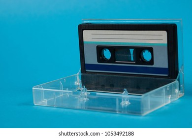 Blank Cassette Tape Box On Blue Background. Vintage Cassette Tape Case With Retro Cassette Mockup. Plastic Analog Magnetic Clear Packaging Template. Mixtape Box Open 