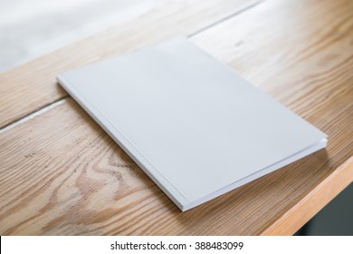 Blank catalog, magazines,book mock up on wood background - Shutterstock ID 388483099