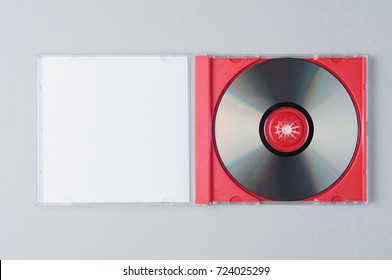 Blank CD on gray background. Mockup for branding