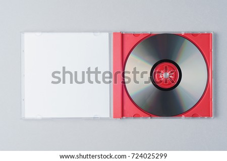 Blank CD on gray background. Mockup for branding