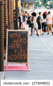 Blank Chalk Board Street Stand With Wooden Frame With The Quote: Work Hard, Have Fun, No Drama.