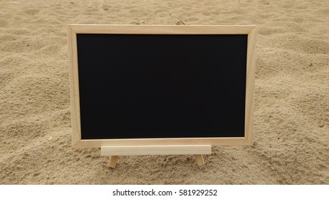 blank chalkboard on sandy beach. Composition of Nature.  