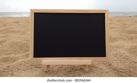 blank chalkboard on sandy beach. Composition of Nature.  