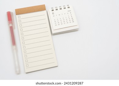 Blank Check list or Empty small notepad with checkbox and Simple desk calendar for JUNE 2024. Blank checklist for text. Copy Space.
