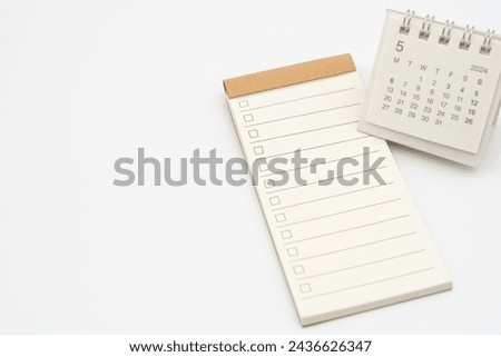 Blank Check list or Empty small notepad with checkbox and Simple desk calendar for MAY 2024. Blank checklist for text. Copy Space. to do list on May.