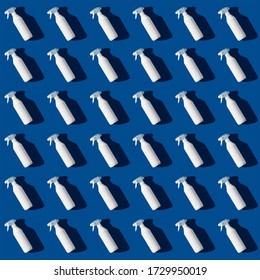 Blank Cleaning Spray Bottle On Bluebackground Pattern. Flat Lay, Top View.