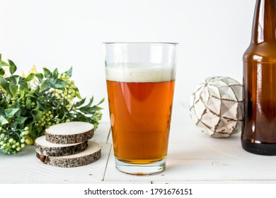 Blank Clear Filled Pint Glass On White Background With Props, Pub Beer Glass Mockup