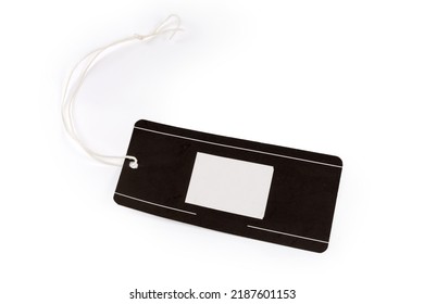 Blank Clothing Swing Tag In The Form Of Black Carton Sheet On A White Rope On A White Background
