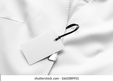 Blank Clothing Tag Label Mockup To Place Your Design, On A White Stylish Womens Premium Cotton Jacket. Fashion Branding Scene