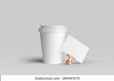Blank coffee cup with a business card, packaging mockup with empty space to display your branding design.