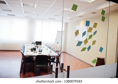 Blank Colored Sticky Note Or Post Note Stuck On Glass Wall At Office.