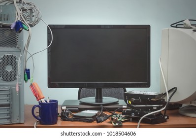 Blank Computer Monitor With Copy Space On Hardware Repair Center. IT Background With Copy Space.