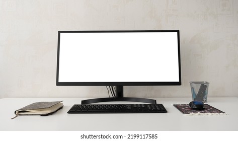 Blank computer screen mockup. Editable layout or template of digital device monitor. White display mockup for advertising, marketing and presentation. Workspace in office or at home. Copy space - Shutterstock ID 2199117585