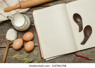 Blank cookbook with some ingredients on the wooden table, top view, rustic style
 - Shutterstock ID 1147061708