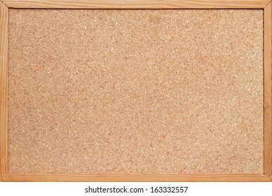 blank corkboard / bulletin board with a wooden frame