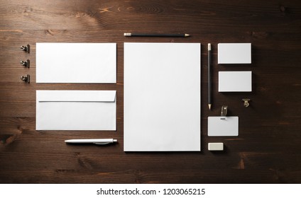 Blank corporate stationery set on wooden background. Branding mock up. Flat lay. - Shutterstock ID 1203065215