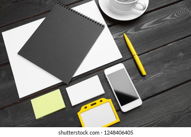 Blank corporate stationery set on wood table background. Branding mock up.