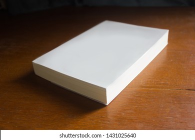 Blank Cover Empty Mockup Pocket Book In Morning Sunlight On Wooden Brown Textured Desk.