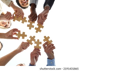 Blank Creative Text Copyspace Background With Diverse Team Of Business People Putting Pieces Of Jigsaw Puzzle Together, Low Angle, Shot From Below, Bottom View. Teamwork And Cooperation Concept