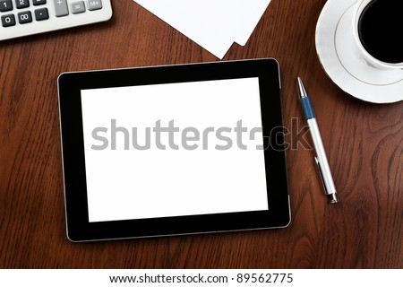 Blank digital tablet on a desk with clipping path for the screen