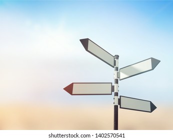 Blank directional road sign on sky background - Shutterstock ID 1402570541