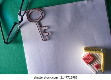 Blank Document With Paper Clip  And Toy Model House    