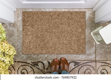 Blank Doormat Before The Door In The Hall. Mat On Ceramic Floor, Flowers And Shoes. Welcome Home, Product Mockup