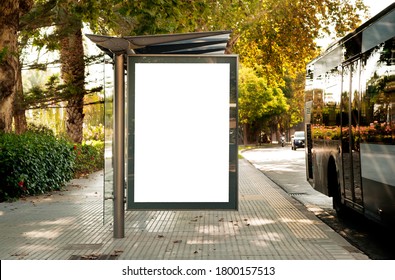 Blank electronic advertising poster with blank space screen for your text message or promotional content, clear banner in urban setting, empty poster at a bus stop, public information billboard