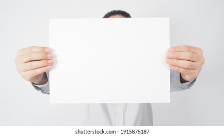 Blank Empty Paper In Man Hand And Wear Shirt On White Background.asian People