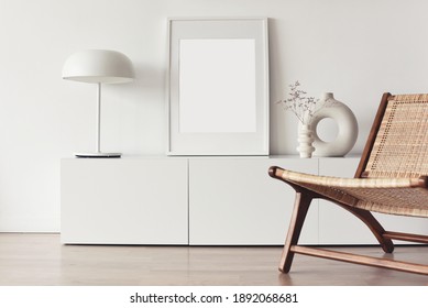 Blank Empty Picture Frame Mockup On White Wall. Living Room Design. View Of Modern Scandinavian Style Interior. Home Staging And Minimalism Concept. Copy Space