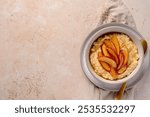 Blank food photography of millet porridge with caramelized peach, nectarine with agave syrup; honey; copy space, menu; recipe