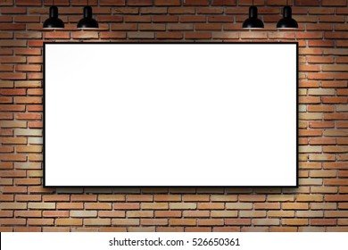 Blank frame on brick wall with lamp. nice show room with spotlights. 