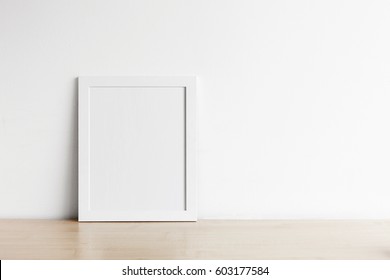 Blank Frame Photo On Wood Table With Copy Space