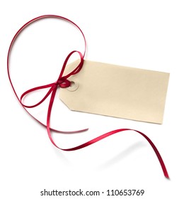 Blank Gift Tag With A Red Ribbon Bow, Isolated On White.