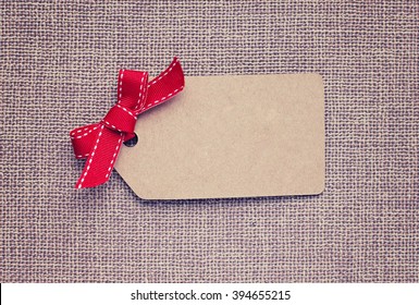 Blank Gift Tag With A Red Ribbon Bow