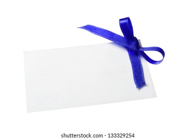 Blank Gift Tag Tied With A Bow Of Blue Satin Ribbon. Isolated On White