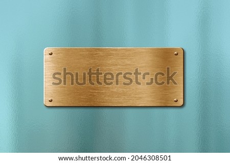 Blank golden name plate on glass background to ad text, names or logos