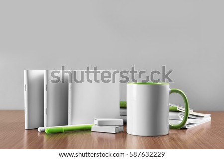 Blank goods on wooden table and grey background