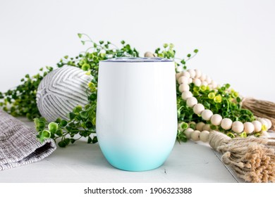 Blank gradient blue teal and white unsulated wine tumbler with rustic decor, drinkware mockup