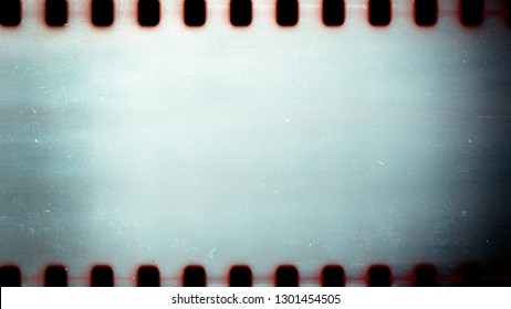 Blank grained film strip texture background with heavy grain dust and scratches