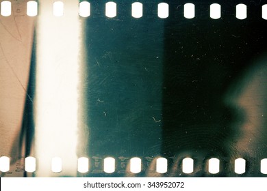 Blank Grainy Film Strip Texture Background With Lots Of Dust, Noise And Light Leak