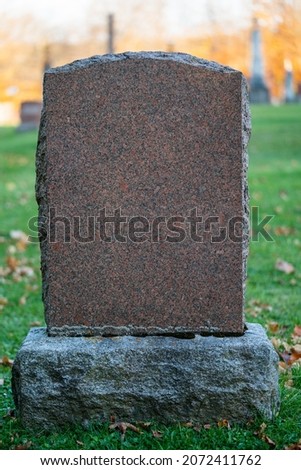 Blank granite tombstone headstone at a cemetery